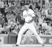  ?? Tony Gutierrez Associated Press ?? RANGERS RELIEF pitcher Alex Claudio can’t contain his excitement after sealing the win Friday.