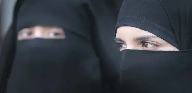  ?? PETER MACDIARMID/GETTY IMAGES/FILES ?? Quebec’s ban on face coverings like these niqab veils, which was passed with the intent of defending “religious neutrality,” would instead restrict religious freedom, and drive those who wear them further from public life.