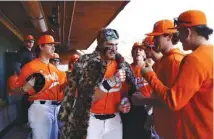  ?? TENNESSEE ATHLETICS PHOTO ?? Tennessee first baseman Blake Burke is congratula­ted by teammates after one of his two home runs during Saturday’s 12-1 whipping of Bowling Green.