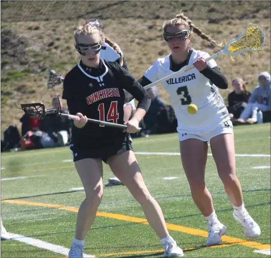  ?? (DOUG HASTINGS PHOTO ?? Billerica’s Giovanna Gulinello (3) and Winchester’s Ava O’gorman eye the ball during a season-opening girls lacrosse meeting on Saturday morning. Host Billerica rallied for an 11-9win.