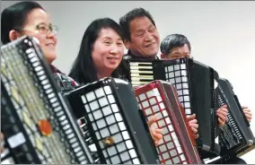  ??  ?? The accordion students rehearse Ah, Goodbye To My Friends, a classic track for many accordion learners.