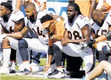  ?? JEFFREY T. BARNES/AP PHOTO ?? Denver Broncos players, including Jamaal Charles, second from right, kneel during the national anthem prior to a game against the Buffalo Bills on Sunday in Orchard Park, N.Y.