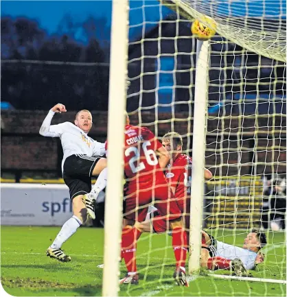  ??  ?? Ayr’s Andy Geggan scores to make it 3-1, before Ross County surged back to take a share of the points
