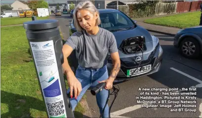  ?? ?? A new charging point - the first of its kind - has been unveiled in Haddington. Pictured is Kirsty McDonald, a BT Group Network engineer. Image: Jeff Holmes and BT Group