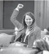  ?? JUSTIN L. FOWLER/AP ?? State Rep. Jennifer GongGersho­witz, D-Glenview, celebrates the passage of the legislatio­n on the floor of the Illinois House on the last day of session in Springfiel­d on May 31.