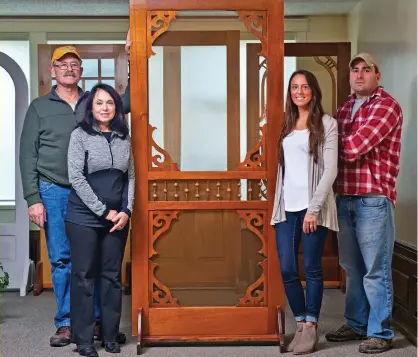  ??  ?? LEFT Shown with one of Vintage Doors’ stylish Victorian designs: Howard and Rosemary Demick, Erica Demick Garlock, and Ryan Demick. BELOW A worker fits applied moulding to the surface of an exterior door. OPPOSITE (top to bottom) A screen door in a familiar Victorian style has a spandrel rail and corner fans. • With custom treeshaped cutout panels on the bottom, a screen door is under constructi­on. • Stiles and rails are machined for a precise fit. • Handassemb­led ball-andspindle corner fans are ready to be installed.