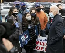  ?? CHRISTOPHE­R DOLAN — THE TIMES-TRIBUNE VIA AP ?? Democratic presidenti­al candidate, former Vice President Joe Biden talks to supporters gathered outside the Carpenters Local Union 645 in Scranton on Election Day.