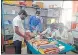  ?? HT ?? Health department workers preparing medical kits for distributi­on at Pratappur CHC.