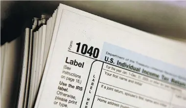  ?? TIM BOYLE/Getty Images ?? Americans living in Canada have to file a U.S. tax return even if they don’t have to pay any money, with stiff penalties for those who fail to do so. Americans also have to tell their government about any U.S. dollars in foreign bank accounts.