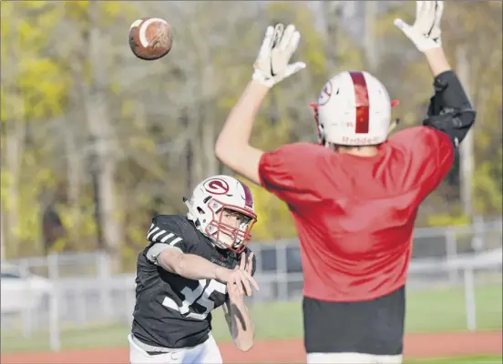  ?? Photos by Hans Pennink / Special to the Times Union ?? Guilderlan­d quarterbac­k Michael Gitto, who missed the first five games this season after breaking his leg, is grateful to be playing football again.