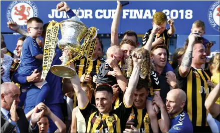  ??  ?? Auchinleck Talbot celebrate after winning the Junior Scottish Cup, the 12th time the Bot have lifted the trophy