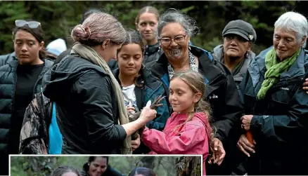  ?? ?? Alison Beath, former DOC Tongariro senior ranger, shows off a kiwi to local iwi members before its release. Left: Conservati­on Minister WillowJean Prime, right, holding a kiwi before its release with DOC Tongariro senior ranger Jenny Hayward and Save the Kiwi’s Renee Potae in the background.