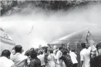  ?? PHOTO: PTI ?? Police use water cannons to disperse Youth Congress activists as they protest demanding the resignatio­n of Pinarayi, in Kochi