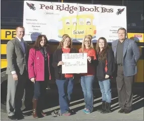  ?? TIMES photograph by Annette Beard ?? Gratefully accepting the grant from author James Patterson, were members of the Pea Ridge school staff, from left: Aaron Gaffigan, Primary school principal; Sarah Stokes, Intermedia­te School principal; Ashley Clark, Tracy Hager, Shannon Brown,...