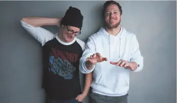  ?? PHOTO BY TAYLOR JEWELL/INVISION/AP ?? Director Don Argott, left, and Dan Reynolds pose for a portrait to promote the film, Believer, at the Music Lodge during the Sundance Film Festival last Sunday in Park City, Utah. The Mormon frontman of the Imagine Dragons rock band hopes his...