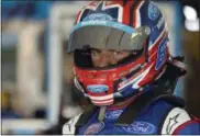  ?? MATT SLOCUM — THE ASSOCIATED PRESS ?? Driver Darrell Wallace Jr. looks out from the garage before practice for Sunday’s NASCAR Cup Series Pocono 400 auto race.