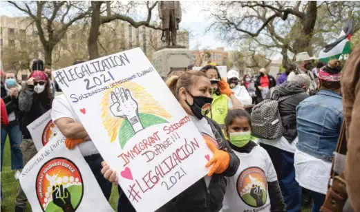  ?? PAT NABONG/SUN-TIMES ?? Hundreds gather at Union Park Saturday to advocate for essential workers, undocument­ed immigrants and an end to police brutality.