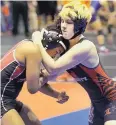  ?? MELISSA PHILLIP/HOUSTON CHRONICLE ?? Mack Beggs, right, a transgende­r wrestler, competes against Mya Engert during the state wrestling tournament in Cypress, Texas.