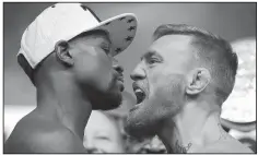  ?? AP/JOHN LOCHER ?? Floyd Mayweather Jr. (left) came out of retirement to defeat MMA champion Conor McGregor in August.