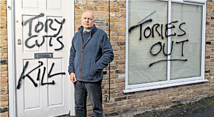  ??  ?? Iain Duncan Smith outside his vandalised Chingford and Woodford Green campaign office