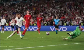  ?? Photograph: Laurence Griffiths/Getty Images ?? Harry Kane scores from the rebound for the winner in extra time after seeing his penalty saved by Kasper Schmeichel.