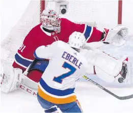  ??  ?? Canadiens goaltender Carey Price makes skate save on Islanders forward Jordan Eberle during the second period in Montreal.