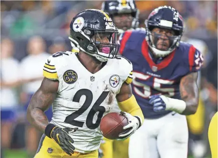 ??  ?? Steelers running back Le’Veon Bell scored a touchdown and rushed for 69 yards in Monday’s 34-6 victory against the Texans that clinched a bye in the first weekend of playoff games. TROY TAORMINA/USA TODAY SPORTS