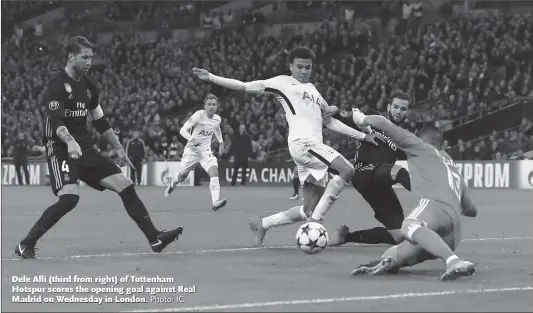  ?? Photo: IC ?? Dele Alli ( third from right) of Tottenham Hotspur scores the opening goal against Real Madrid on Wednesday in London.