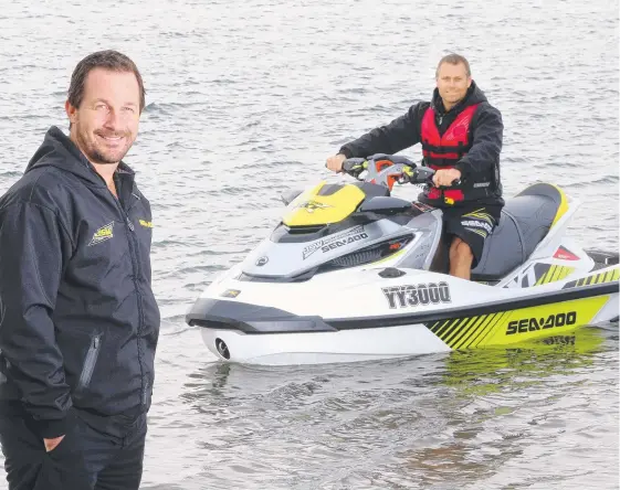  ?? Picture: RICHARD GOSLING ?? JSW Powersport­s owner Jeff McNiven and staff member Anthony Antees have enjoyed another huge year for jetski sales.