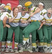  ?? Steph Chambers/Post-Gazette ?? Penn-Trafford's Brooke Cleland leaps onto home plate after her two-run home run in a 6-2 win against West Allegheny.