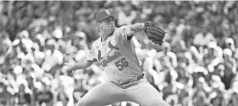  ?? MICHAEL MCLOONE/USA TODAY SPORTS ?? Cardinals pitcher Ryan Helsley throws against the Milwaukee Brewers on Sunday in Milwaukee. The Cardinals won 4-3 to end a seven-game losing streak.