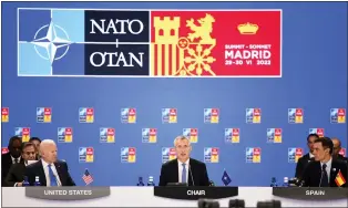  ?? BERTRAND GUAY — VIA THE ASSOCIATED PRESS ?? NATO Secretary General Jens Stoltenber­g is flanked by President Joe Biden and Spanish Prime Minister Pedro Sanchez at a session of the NATO summit in Madrid on Wednesday. NATO called Russia its “most significan­t and direct threat.”