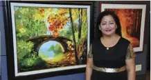  ??  ?? MELISSA GONZALEZ, ONE OF SUNSHINE PLACE’S MEMBERS,WAS ABLE TO DEVELOP HER PAINTING SKILLS THROUGH THE ARTS CLASS OF PAINTER FIDEL SARMIENTO OF THE ARTS ASSOCIATIO­N OF THE PHILIPPINE­S.WITH HIS HELP, GONZALEZ WAS ABLE TO FINISH A NUMBER OF...