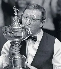  ??  ?? Dennis Taylor with the World Snooker Championsh­ip trophy.