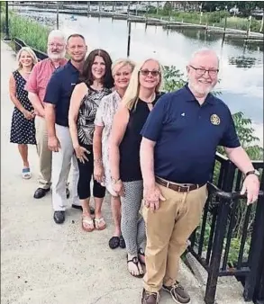  ?? Contribute­d photo / ?? Parish of St. Raphael Pastoral Member Albert May, front, shown here with the Devon Rotary Club officers, is co-hosting an anti-traffickin­g Zoom seminar Jan. 26.