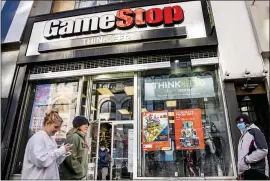  ?? JOHN MINCHILLO — THE ASSOCIATED PRESS FILE ?? The GameStop store in the Manhattan. The company said its shares will be sold through an “at-the-market” offering, which lets a publicly traded company raise capital over time by offering securities into the already existing trading market.