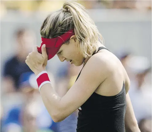  ?? TYLER ANDERSON / NATIONAL POST ?? Eugenie Bouchard reacts to a missed shot against Germany’s Angelique Kerber during their Olympic match Monday.