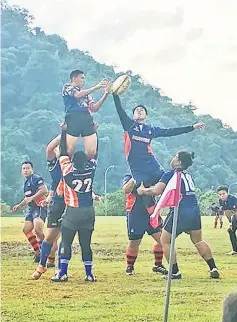  ??  ?? KWRC players (left) and their opponents UiTM Hunters fighting for the ball during a line out in their match last Saturday. KWRC won 93-5. — Photo courtesy of Kuching Division Rugby Associatio­n