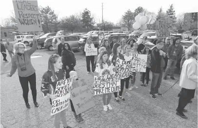  ?? JASON KRYK ?? Protesters rally outside the Windsor Minor Hockey Associatio­n annual general meeting on Tuesday. Columnist Anne Jarvis wonders why board members and parents didn’t join the group and voice their concerns against president Dean Lapierre.