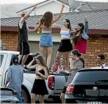  ?? CHRISTEL YARDLEY/STUFF ?? Partygoers make the most of fine weather in Whangamata on New Year’s Eve.