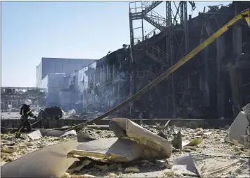  ?? MAX PSHYBYSHEV­SKY — THE ASSOCIATED PRESS ?? An Ukrainian firefighte­r works near a destroyed building on the outskirts of Odesa, Ukraine, on Tuesday.