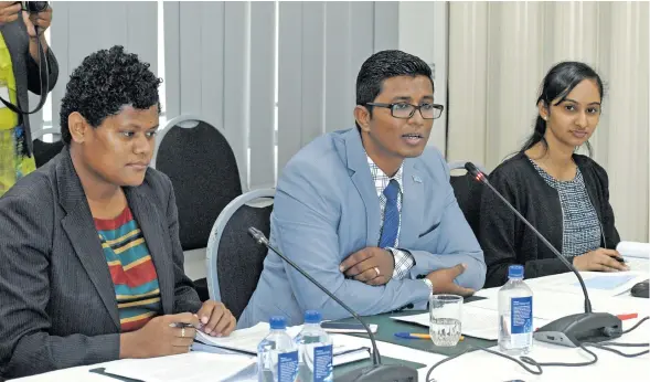  ?? Photo: Vilimoni Vaganalau. ?? Fijian Competitio­n and Consumer Commission manager legal Senikavika Jiuta, chief executive officer Joel Abraham, and manager economic regulation Sundhia Ben presenting FCCC’s submission to the Parliament­ary Standing Committee on Economic Affairs on...