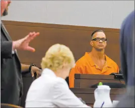  ?? Richard Brian ?? Las Vegas Review-journal @vegasphoto­graph Death row inmate Scott Dozier appears before Judge Jennifer Togliatti during a hearing Monday at the Regional Justice Center about his execution.