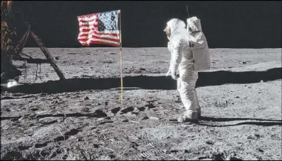  ?? Neil Armstrong NASA via The Associated Press ?? In this July 20, 1969, photo made available by NASA, astronaut Buzz Aldrin Jr. poses for a photograph beside the U.S. flag on the moon during the Apollo 11 mission.