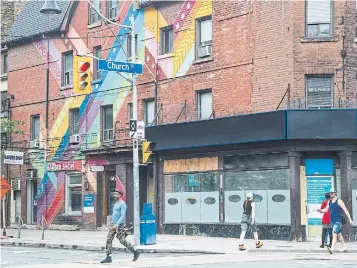  ?? BERNARD WEIL TORONTO STAR FILE PHOTOS ?? This year, especially as we near the holidays, I’ve often wondered about young LGBTQ people, JP Larocque writes. I feel for them, confined to their homes and deprived of this time to experience the power of gay bars in the Village; to have the chance to sit alone in those corners and observe queer life.