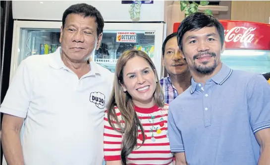  ?? EPA ?? Filipino boxing champion and Emmanuel Manny ‘Pacman’ Pacquiao, right, and wife Jinkee Jamora-Pacquiao with President Rodrigo Duterte in May.