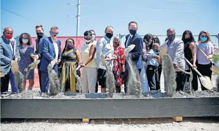  ?? [SARAH PHIPPS/ THE OKLAHOMAN] ?? Dignitarie­s and community members break ground on the Greenwood Rising Black Wall Street History Center on Friday in Tulsa's Greenwood District.