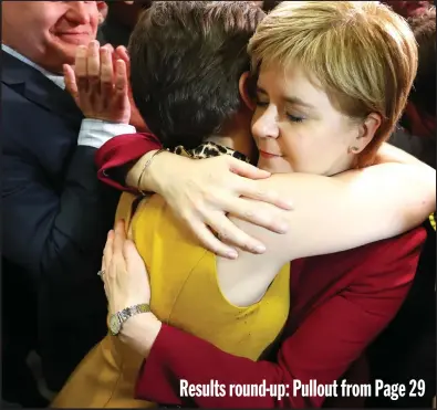  ??  ?? First Minister Nicola Sturgeon hugs a supporter at the Emirates Arena in Glasgow, as counting gets under way