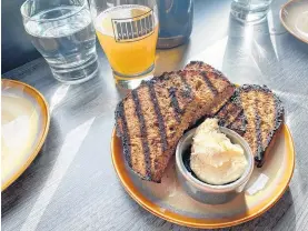  ?? GABBY PEYTON PHOTO ?? The snack menu at Bar Brewdock offers dishes like housemade beer bread with whipped brown butter.