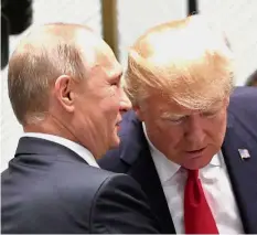  ??  ?? Apparent closeness: Trump and Putin talking before a session of the Apec summit in Danang, Vietnam. — Reuters